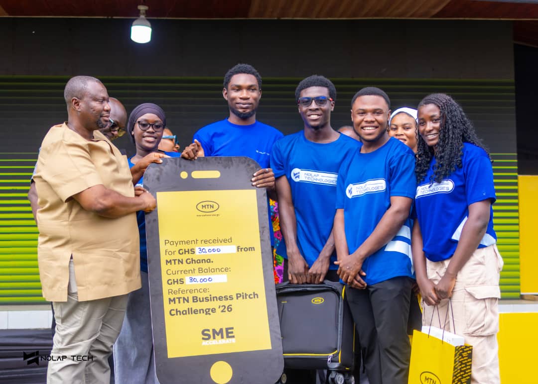 The NOLAP Technologies team in blue shirts holding the MTN cheque for GHS 30,000
